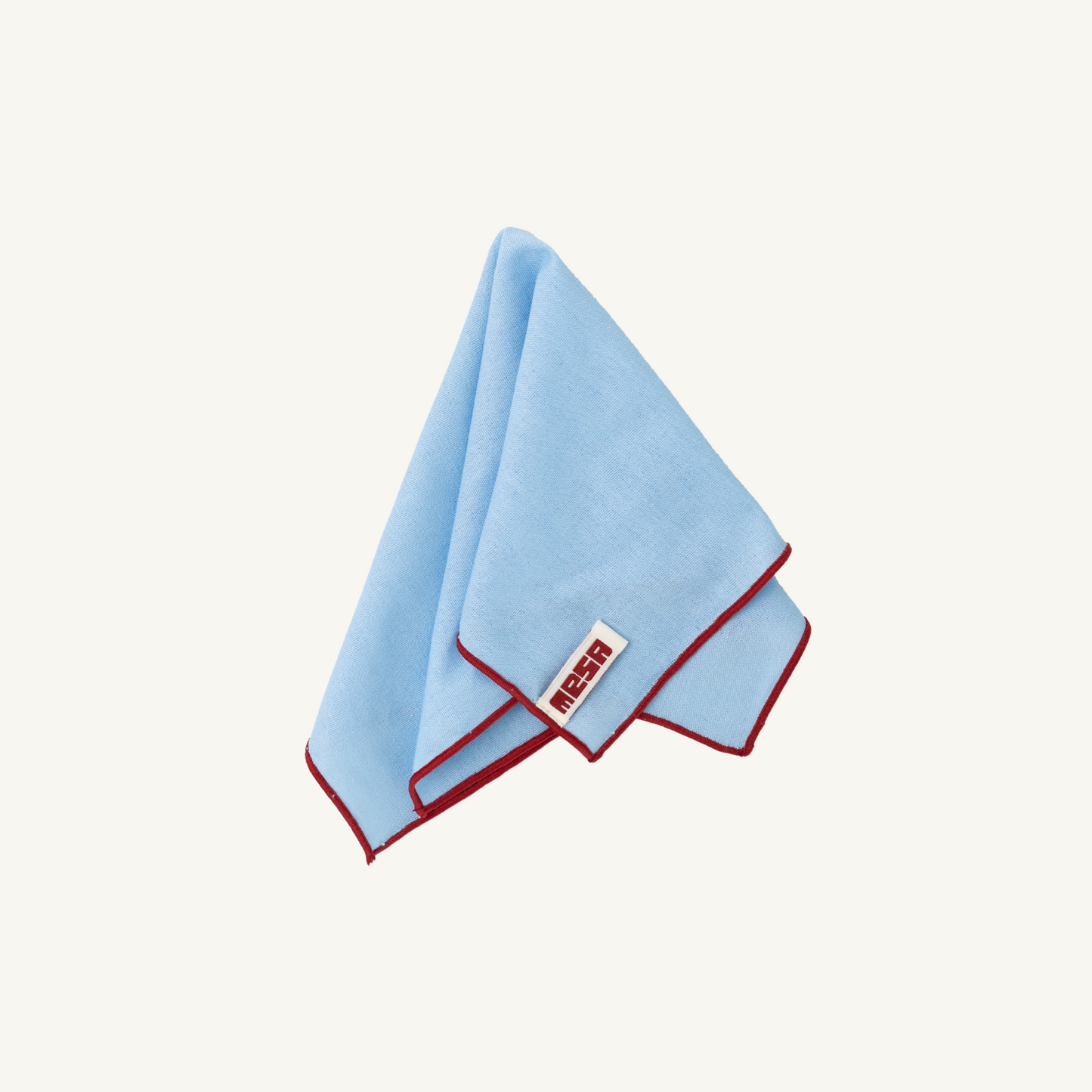 clear sky napkin with red trim