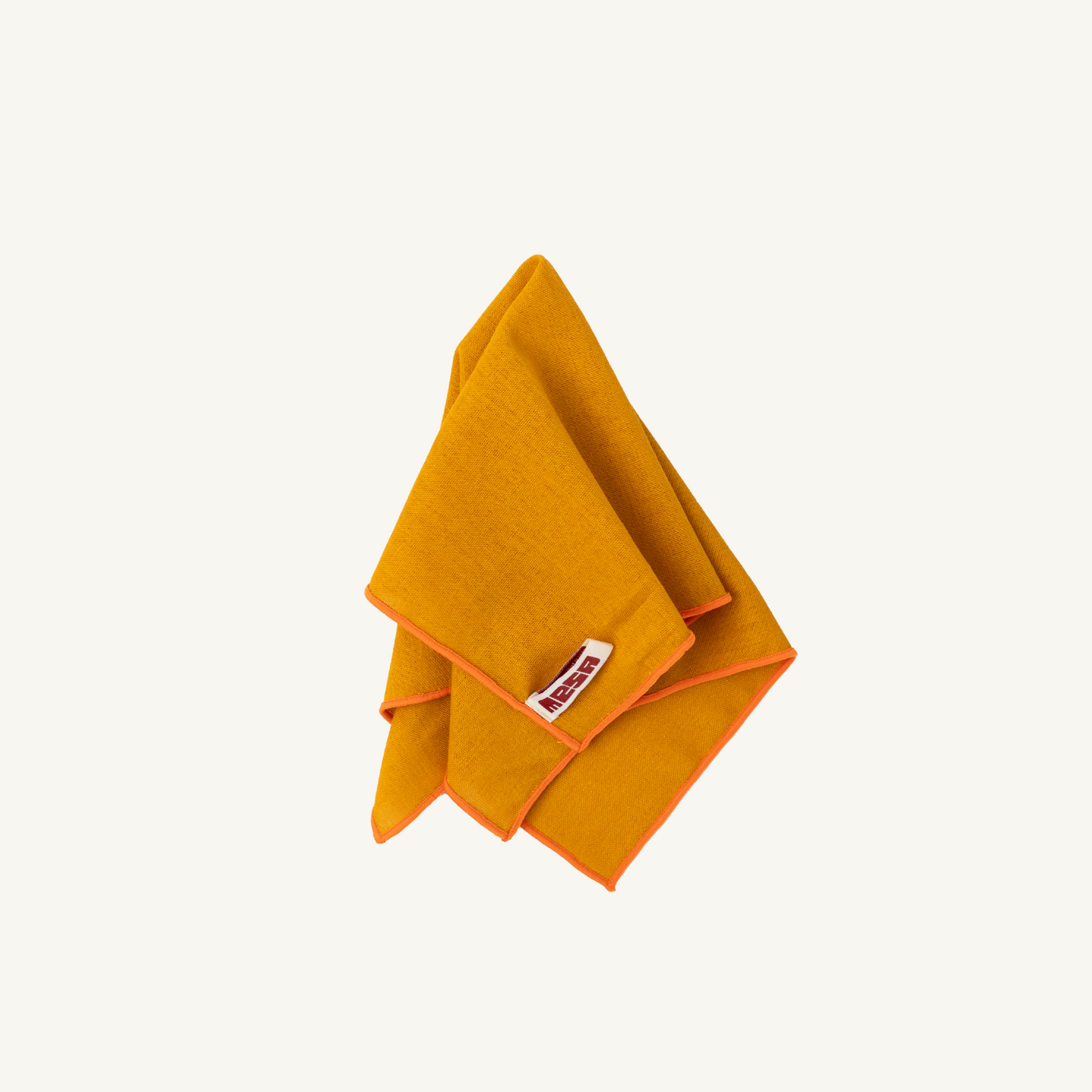 golden sand napkin with orange trim