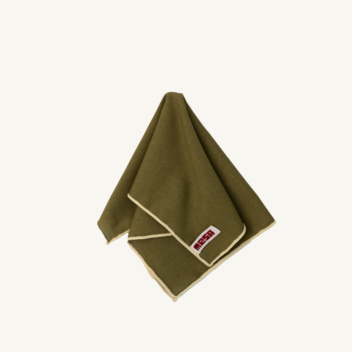 olive green napkin with cream trim